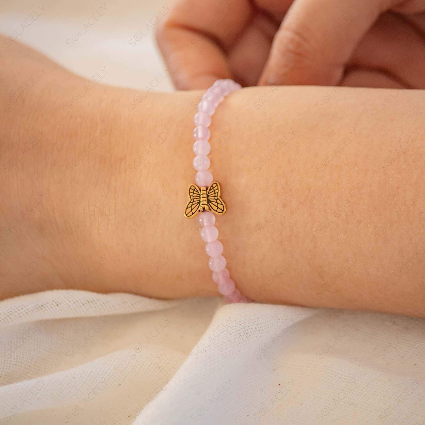 4mm rose quartz bracelet with beautiful butterfly charm