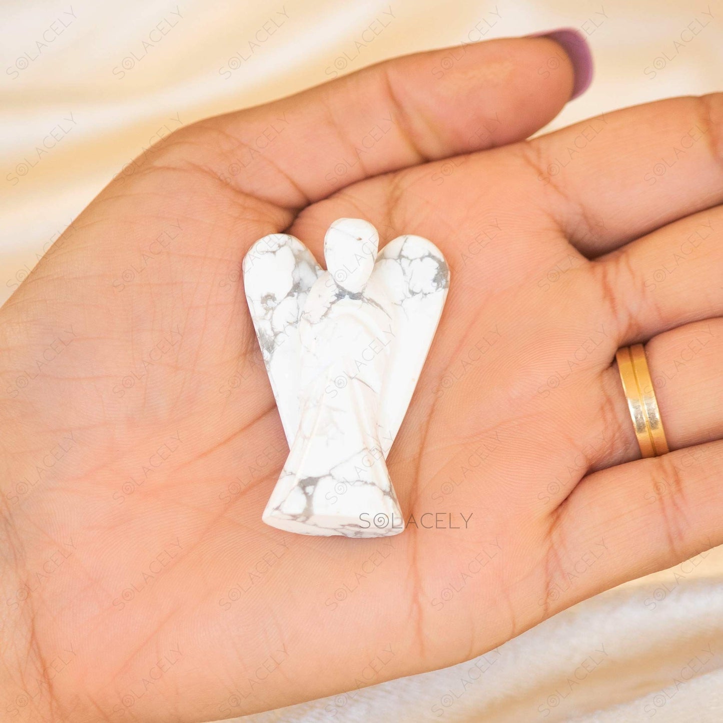 angel shaped howlite crystal