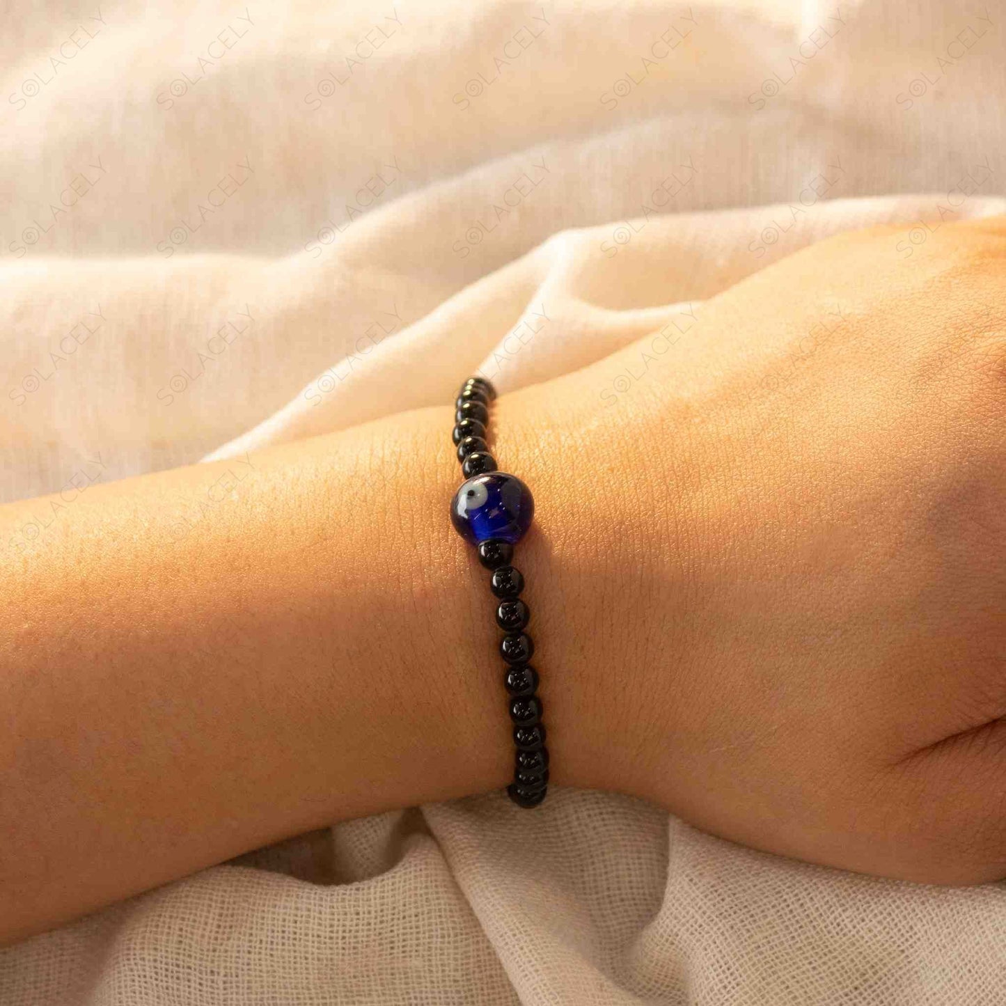 evil eye charm with 4 mm black tourmaline bracelet