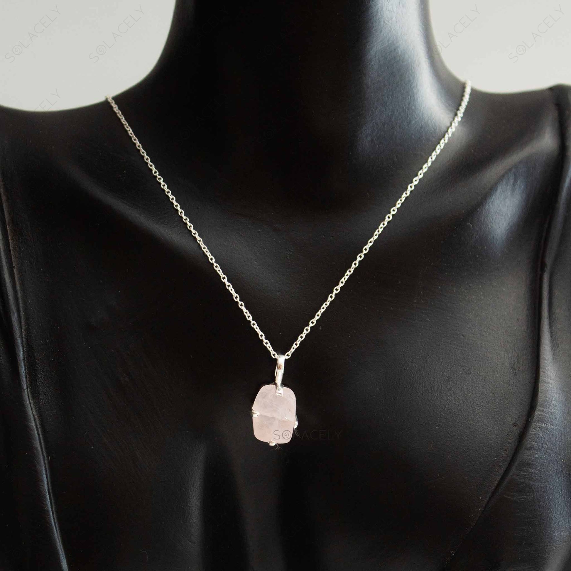 elegant raw rose quartz necklace with sterling silver setting