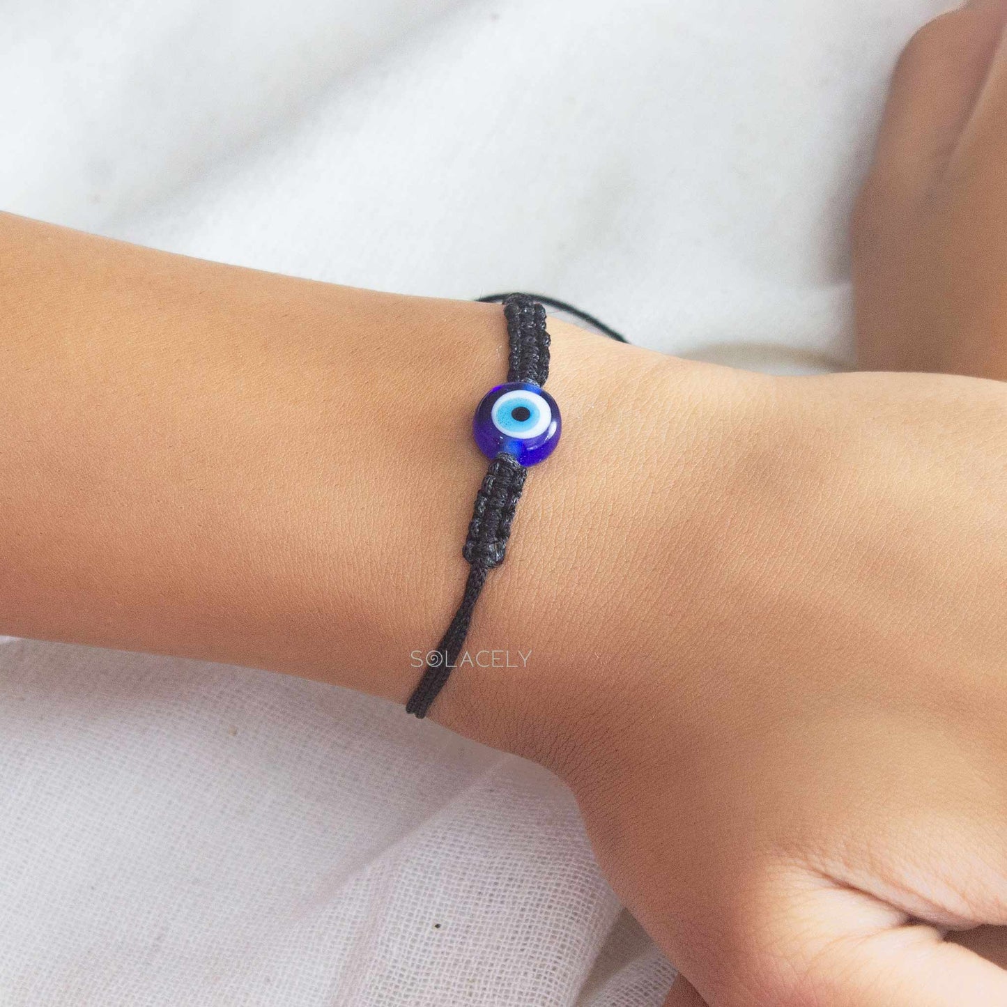 evil eye black string bracelet