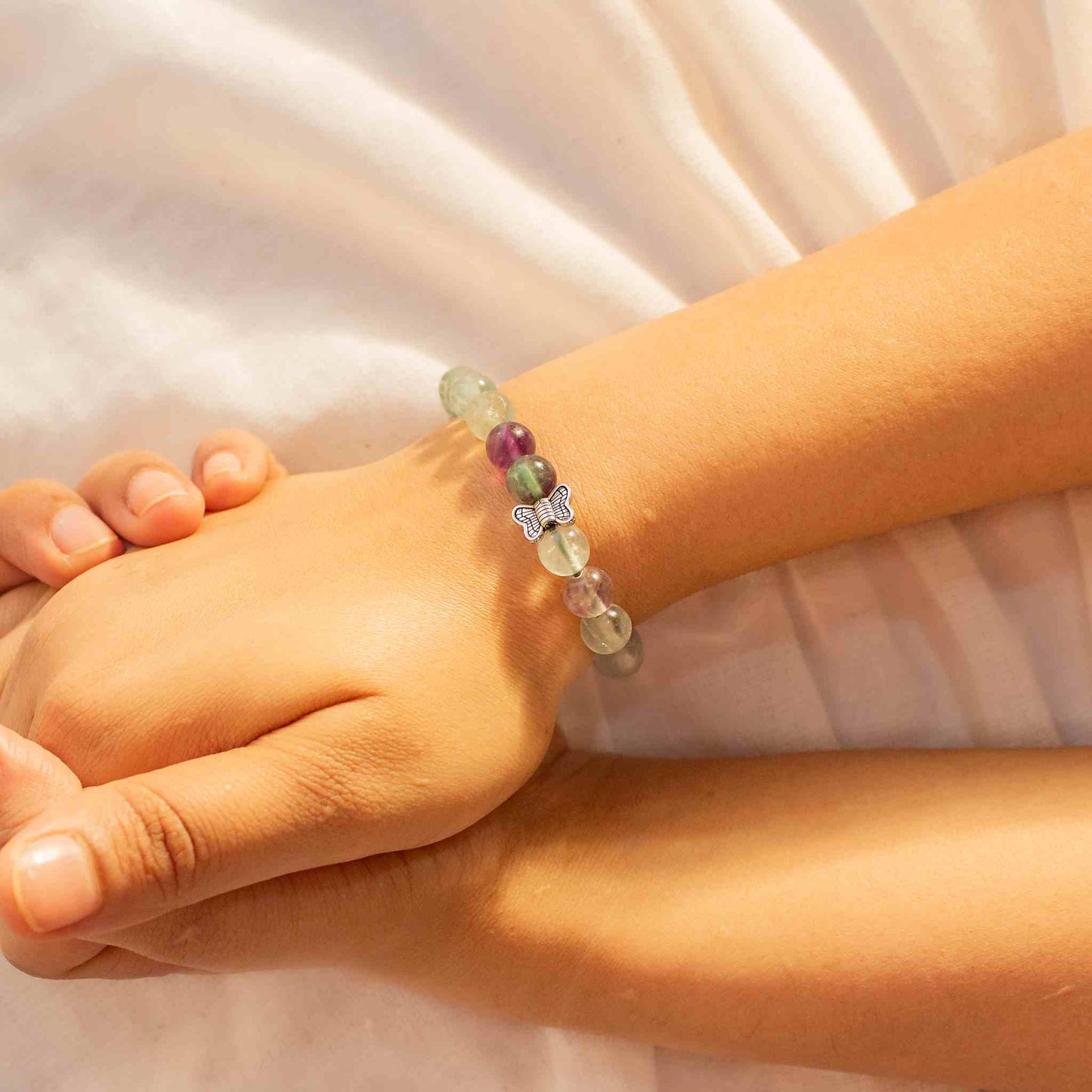 rainbow fluorite bracelet with butterfly charm