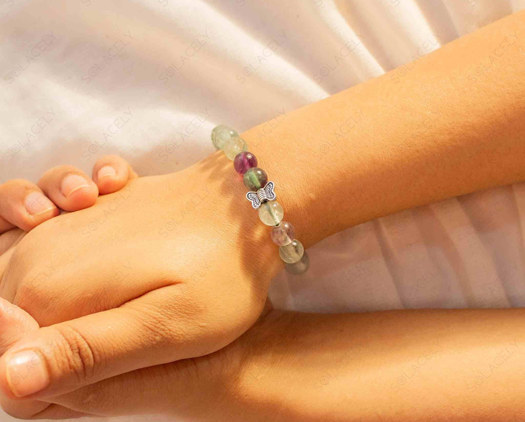 rainbow fluorite bracelet with butterfly charm
