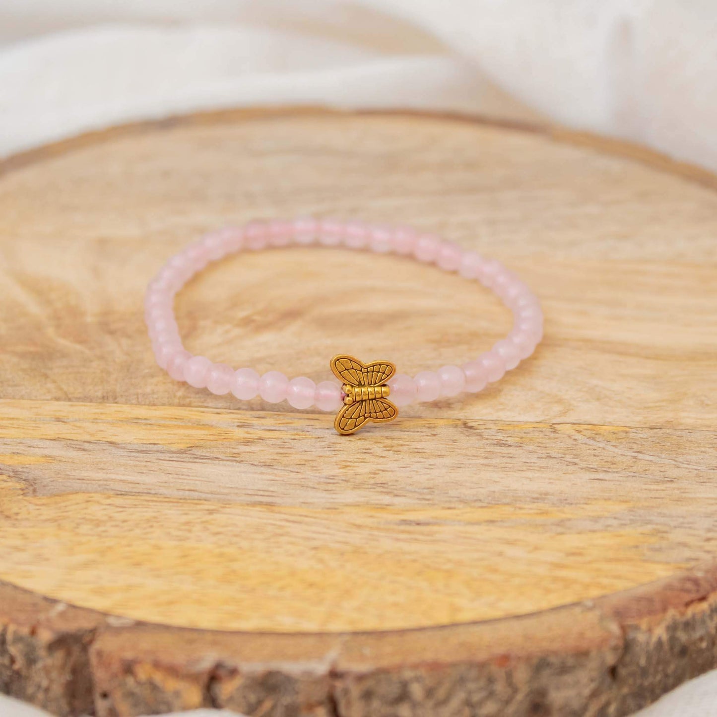rose quartz 4mm bead bracelet with butterfly charm