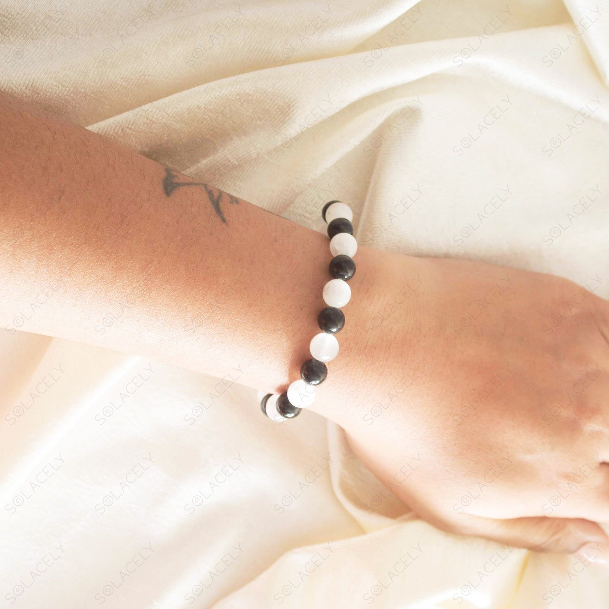 selenite black tourmaline bracelet display