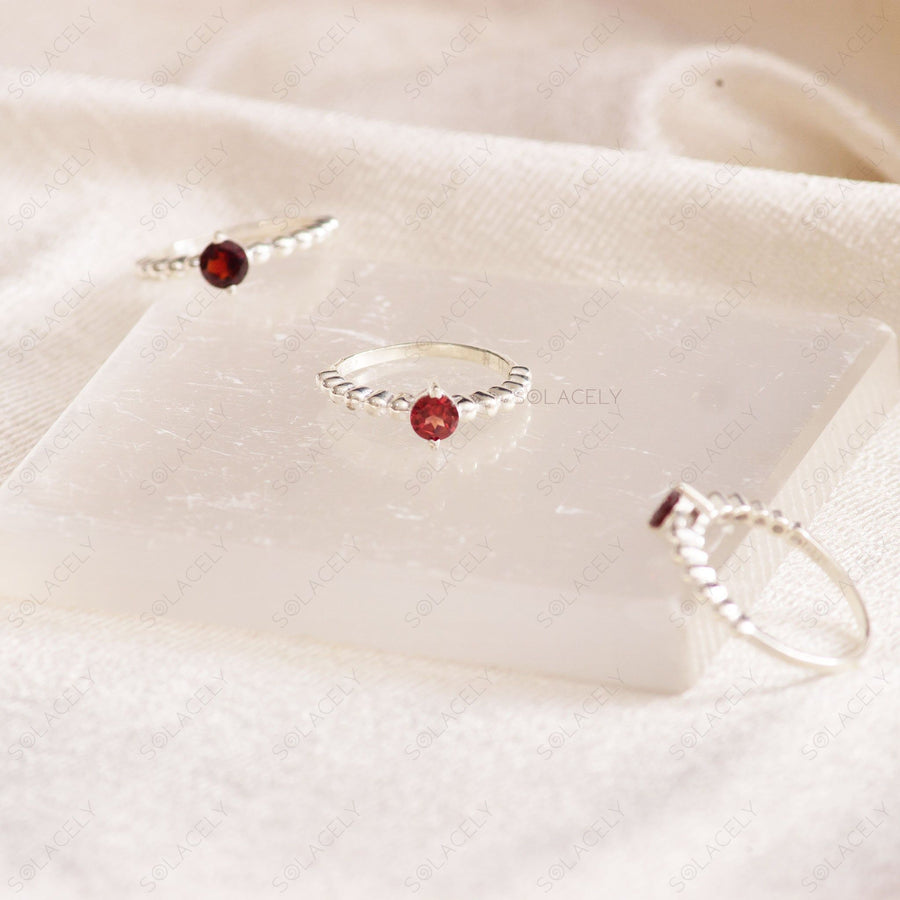 sterling silver faceted red garnet ring